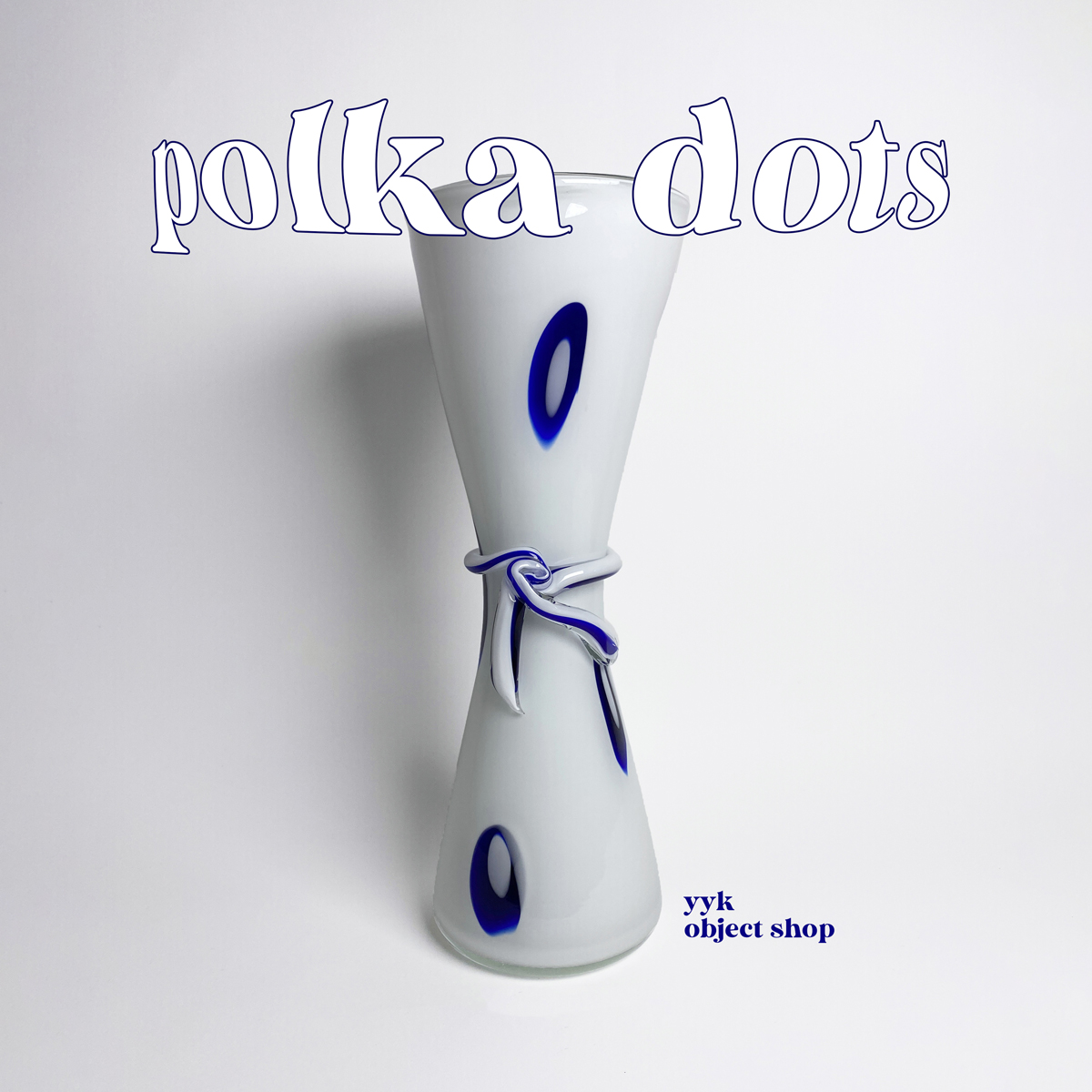 [Blue POLKA DOTS and White glass object]